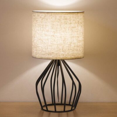 Minimalist table lamp with hollow base.