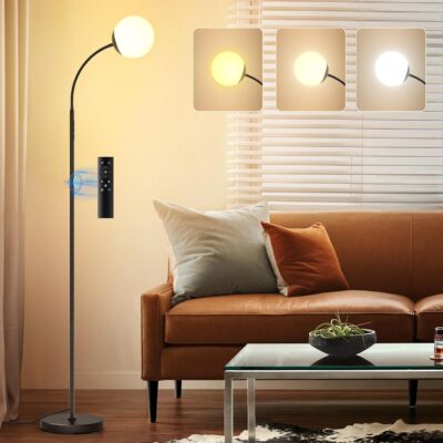 Minimalist gold floor lamp with fabric shade.